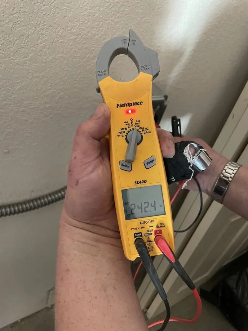 Voltage testing with clamp meter during Ceiling Fan Installation in East Greenville